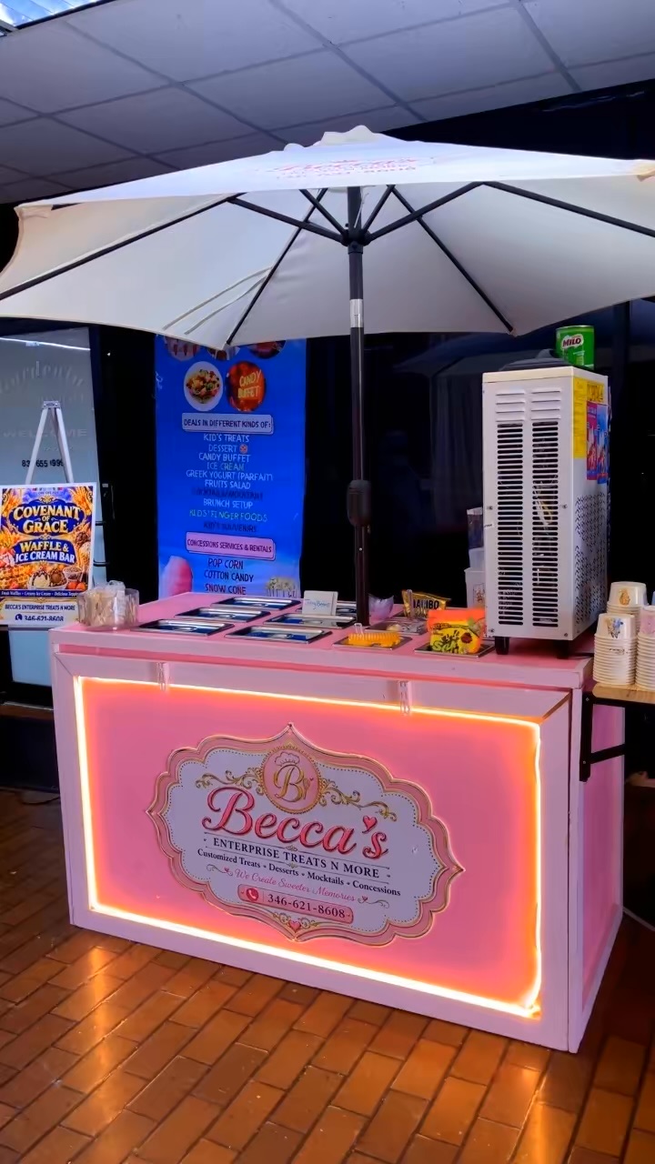 Becca's illuminated pink treat cart and branded umbrella at the Covenant of Grace harvest