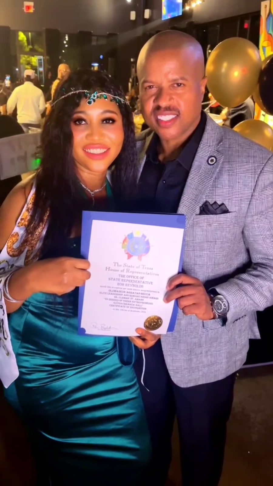 Becca receiving Texas House recognition with Ron from the Office of Texas State Representative Ron Reynolds